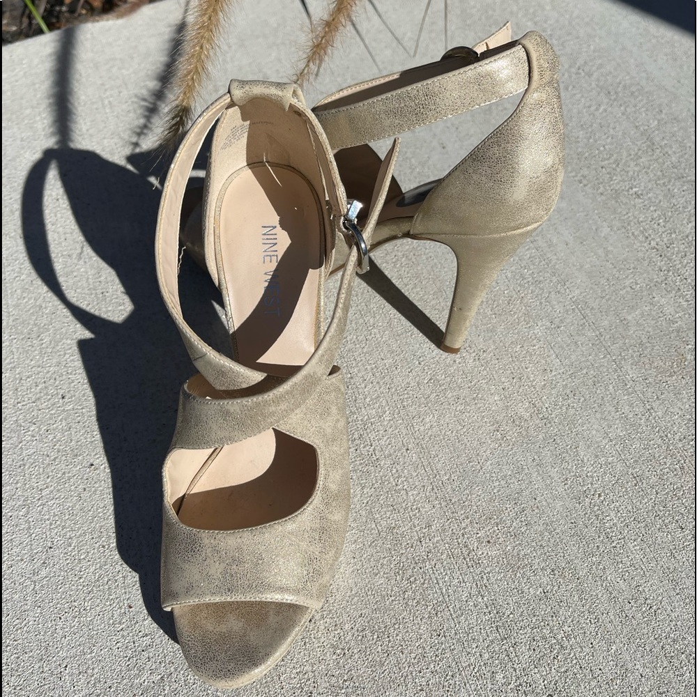 Size 7 Nine West brand, Gold high heels with ankle buckle strap, never worn.